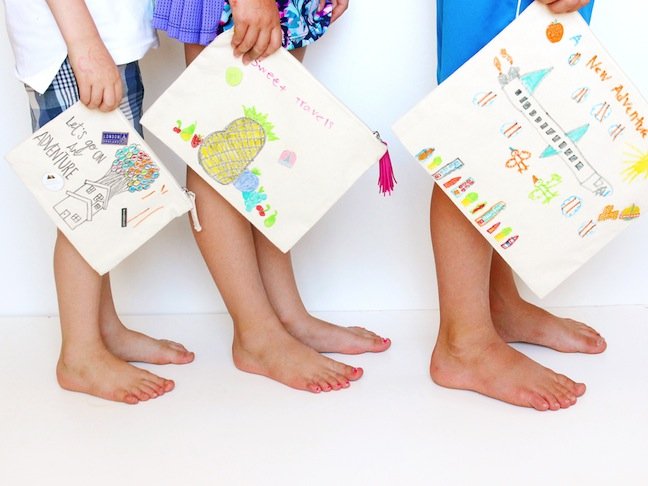 kids-feet-and-hands-holding-bags