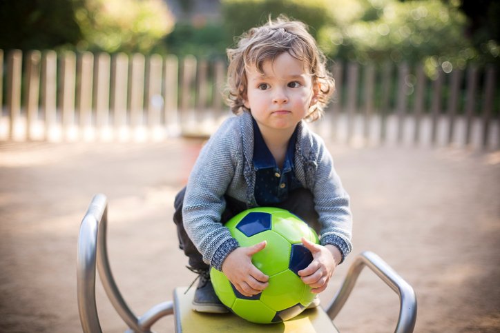 Toddler deals kicking ball
