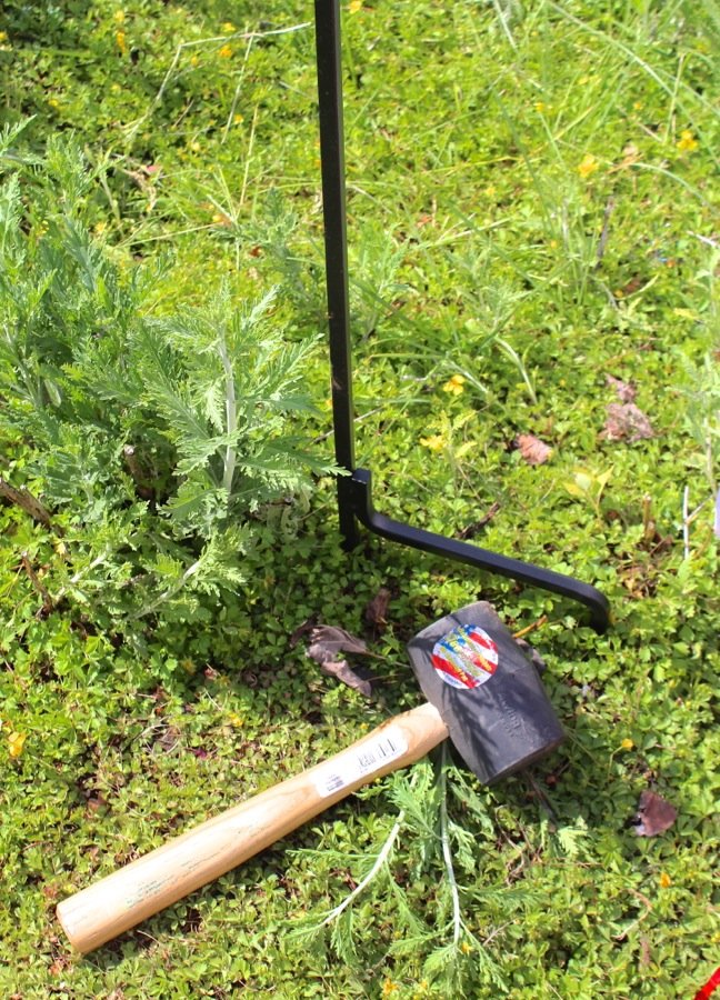 hammer-and-bottom-of-a-shepards-hook-in-the-ground