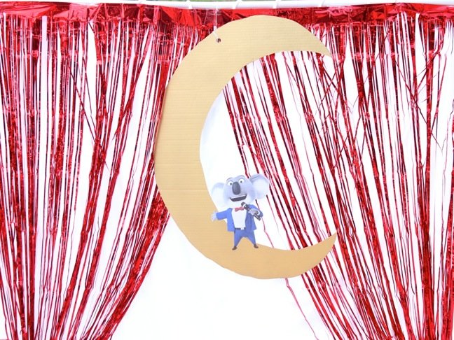diy-kids-stage-with-red-fringe-metallic-curtain-and-buster-moon-koala-character-from-sing