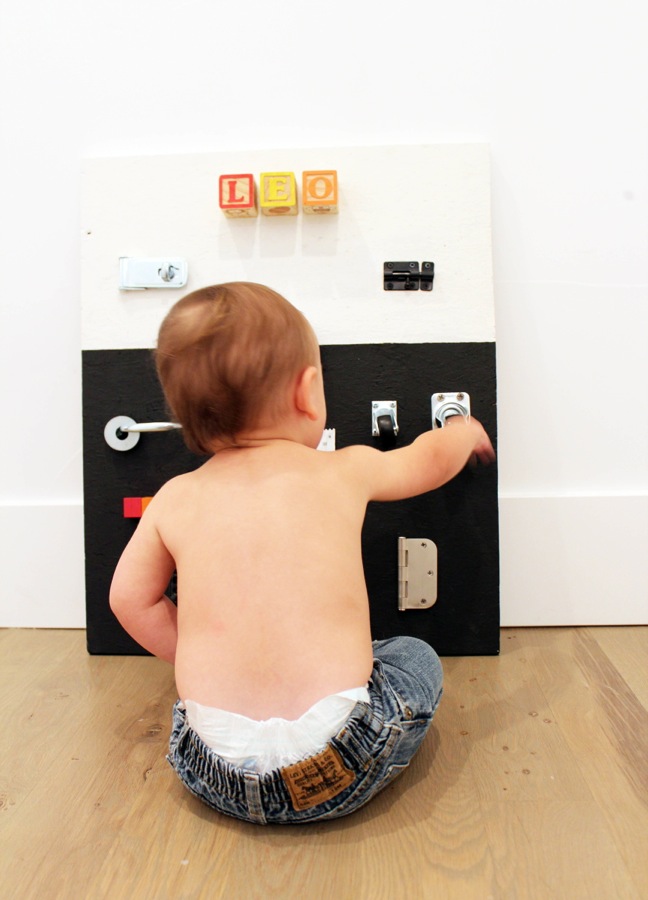 diy-black-and-white-busy-board-for-toddlers-with-hardware-and-rainbow-blocks