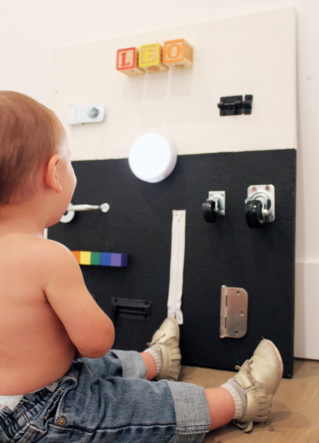 diy-black-and-white-busy-board-for-toddlers-with-hardware-and-rainbow-blocks