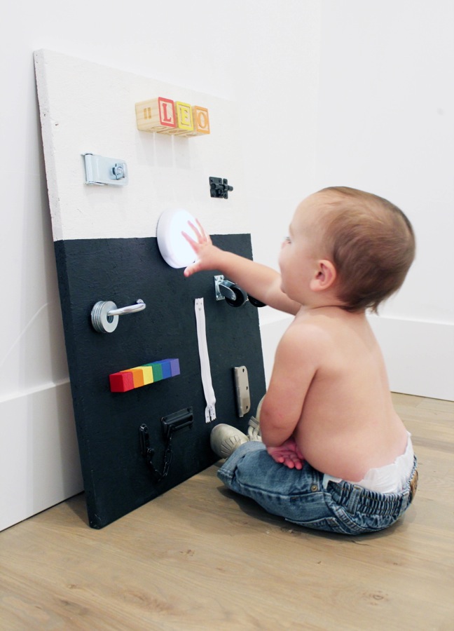 diy-black-and-white-busy-board-for-toddlers-with-hardware-and-rainbow-blocks