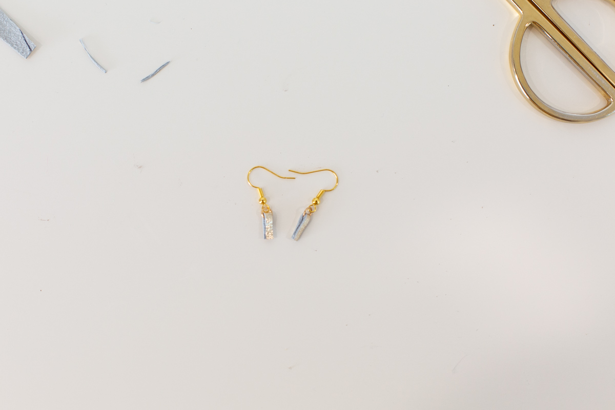 Fish hook earring backs with gold leather strips