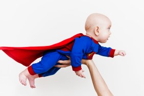 Baby wearing super hero outfit
