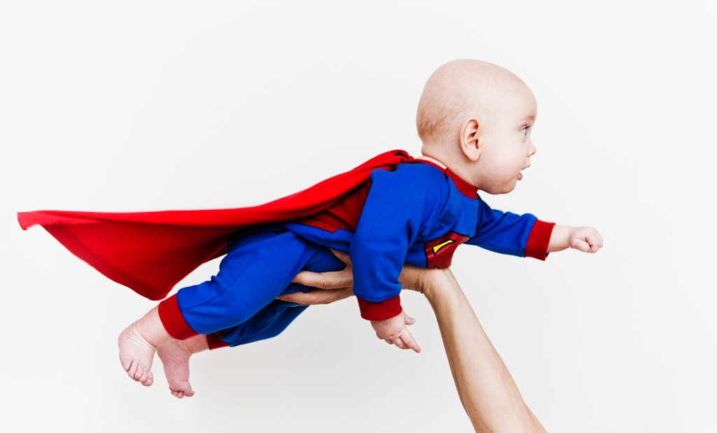 Baby wearing super hero outfit