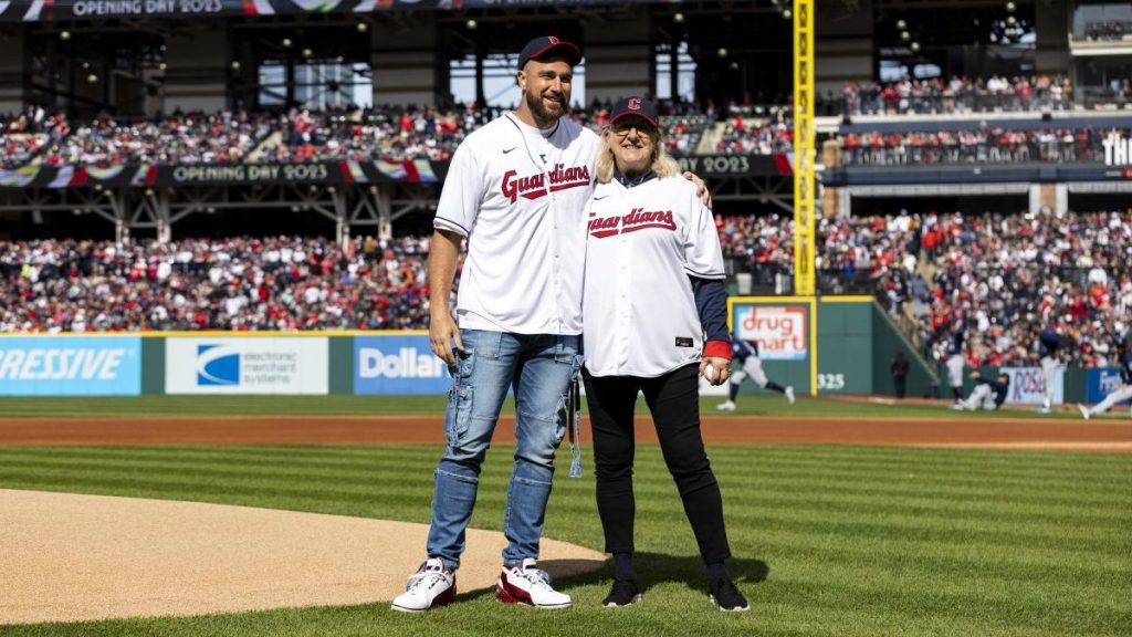 Travis Kelce #87 of the Kansas City Chiefs and his mom, Donna Kelce, stand on the field before the first pitch during the game between the Seattle Mariners and the Cleveland Guardians at Progressive Field on Friday, April 7, 2023 in Cleveland, Ohio.