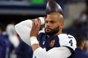 Dak Prescott #4 of the Dallas Cowboys warms up on the sidelines during a game against the Washington Commanders at AT&T Stadium on November 23, 2023 in Arlington, Texas.