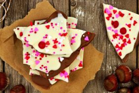White and dark chocolate bark with almonds and candy heart sprinkles for Valentine's Day