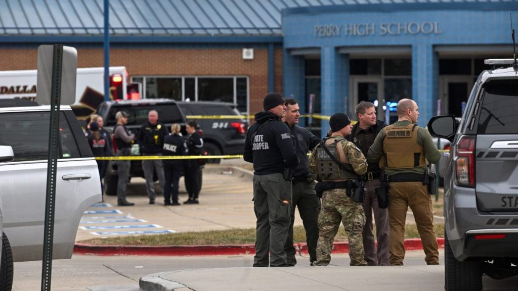 Law enforcement officers are seen outside Perry High School after a mass shooting on Thursday, January 4, 2004 in Perry, Iowa. Dallas County Sheriff Adam Infante said multi people were wounded in the shooting, which is under investigation.