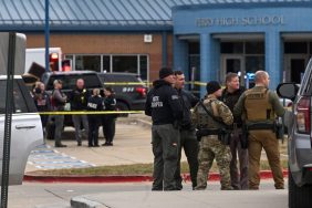 Law enforcement officers are seen outside Perry High School after a mass shooting on Thursday, January 4, 2004 in Perry, Iowa. Dallas County Sheriff Adam Infante said multi people were wounded in the shooting, which is under investigation.