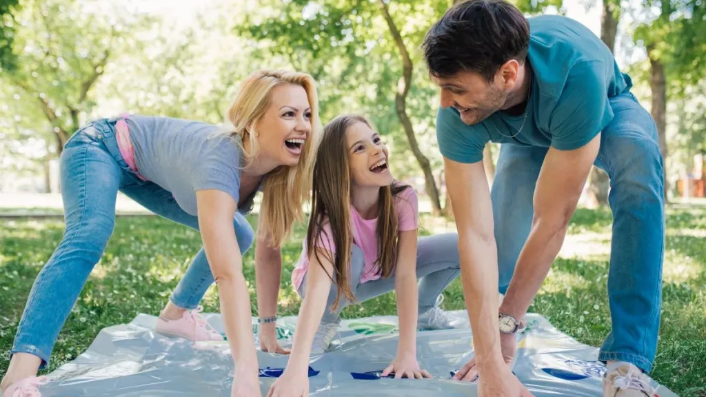 Family playing twister game together
