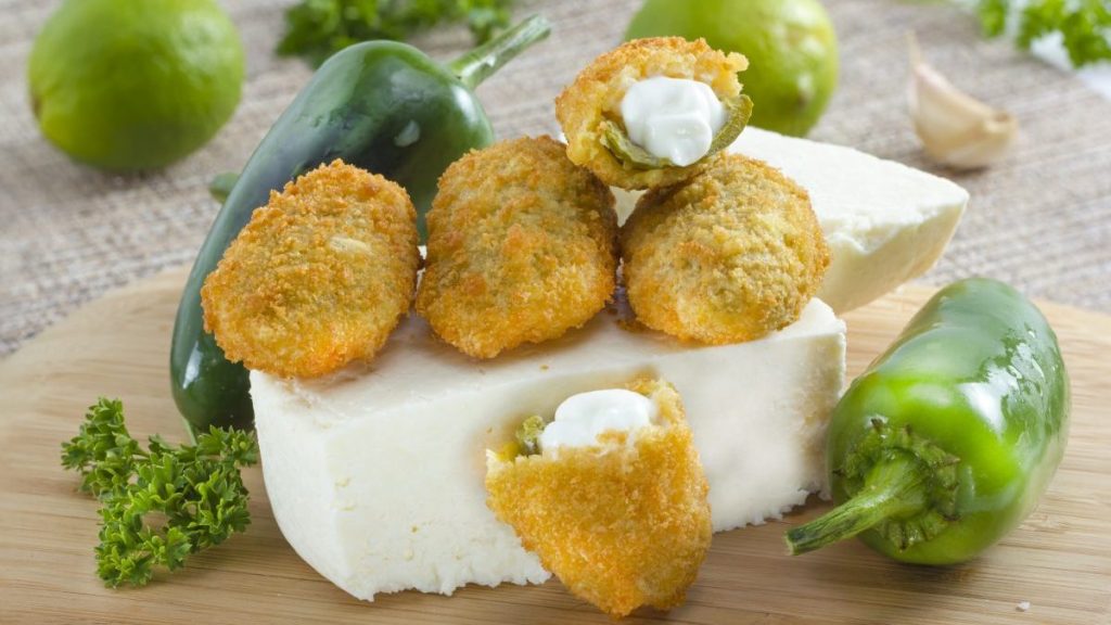 Mexican-american jalapeno poppers served with lime