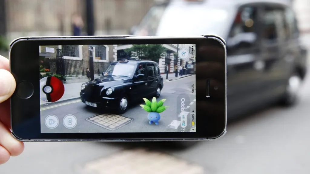 An Oddish Pokemon character appears in front of a London taxi during a game of Pokemon Go, a mobile game that has become a global phenomenon, on July 15, 2016 in London, England. The app lets players roam using their phone's GPS location data and catch Pokemon to train and battle.The game has added millions to the value of Nintendo, which part-owns the franchise.