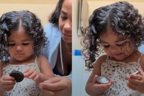 Girl is waiting patiently to eat a cookie