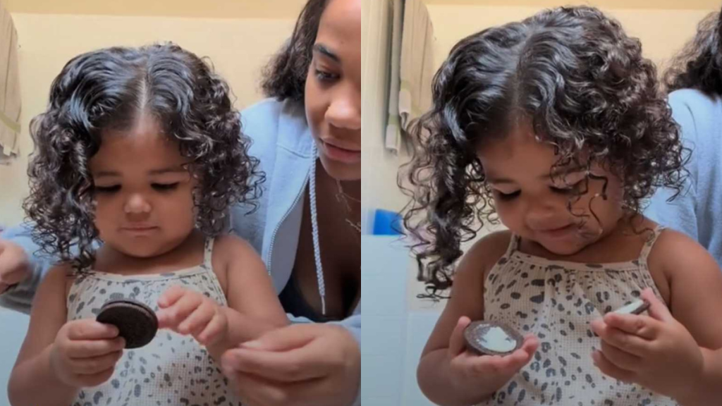 Girl is waiting patiently to eat a cookie