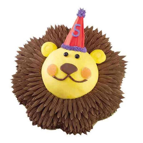 Use wafers, an ice cream cone, and nougat to create a circus cake. 