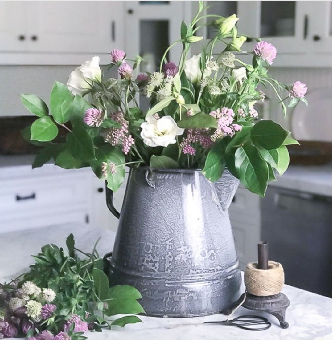 Flowers In a Large Coffee Pot