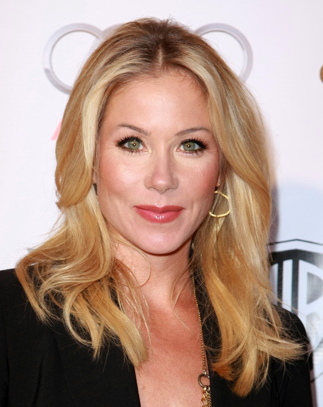 Christina Applegate gold earrings, black blazer