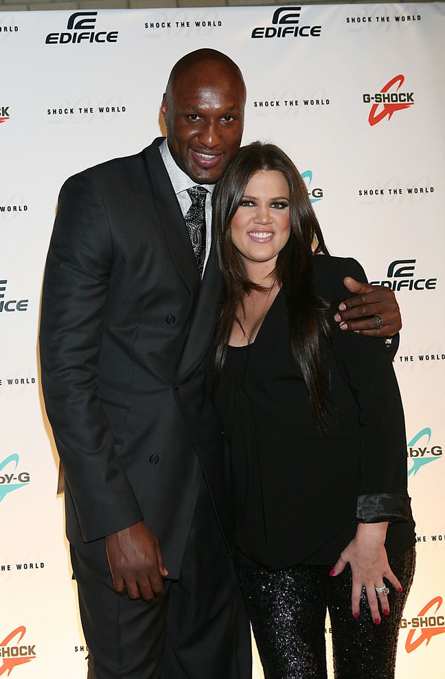 Khloe Kardashian, black blouse, glittery shimmer black pants, Lamar Odom, suit