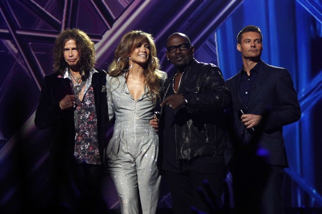 Jennifer Lopez, American Idol announcements, silver jumper, large silver hoop earrings, Steven Tyler, Randy Jackson, Ryan Seacrest